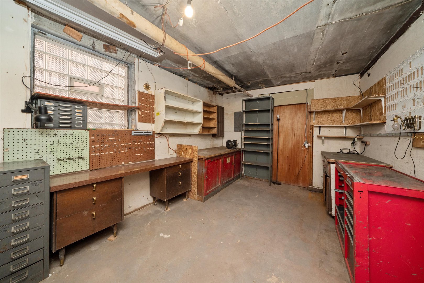 7611 South Aberdeen Street Chicago, IL 60620 - Photo 28 of 45 a kitchen with stainless steel appliances kitchen island granite countertop a table chairs in it