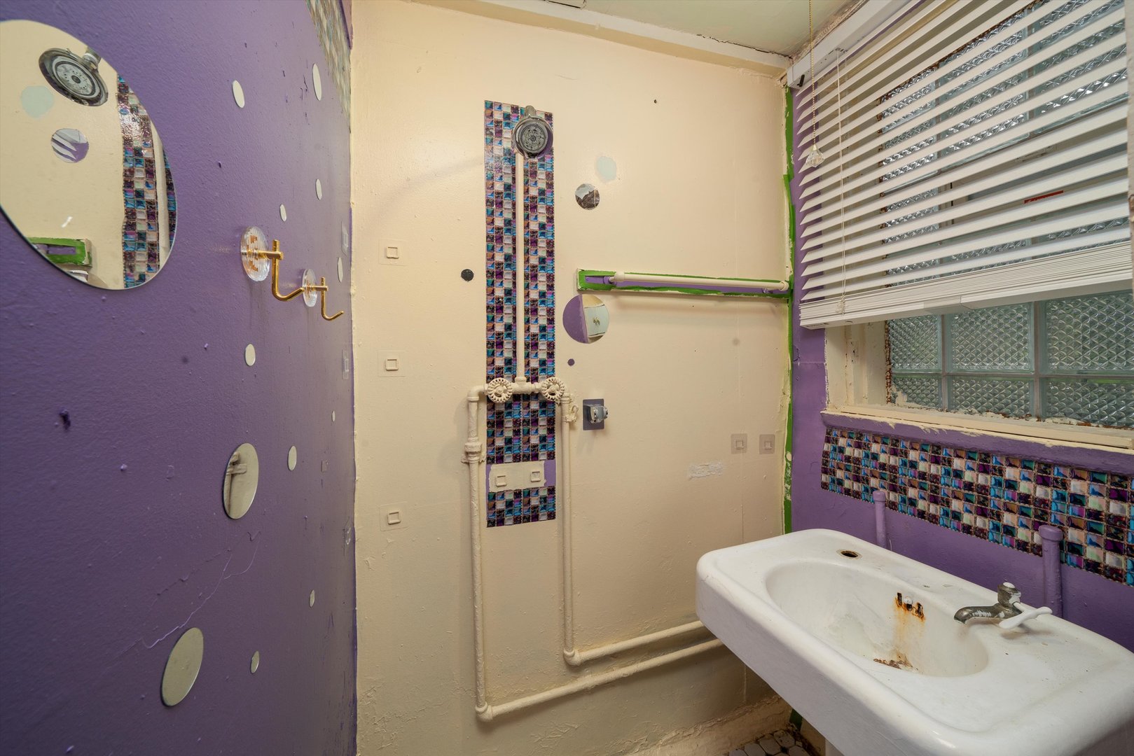 7611 South Aberdeen Street Chicago, IL 60620 - Photo 30 of 45 a bathroom with a sink a toilet and shower