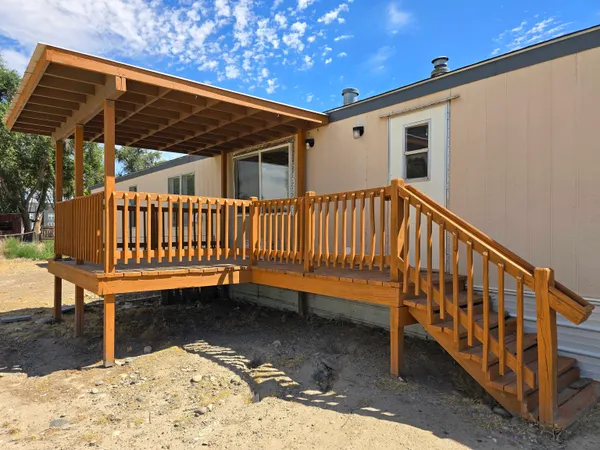 a view of a small deck with a bench