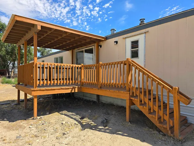 a view of a small deck with a bench