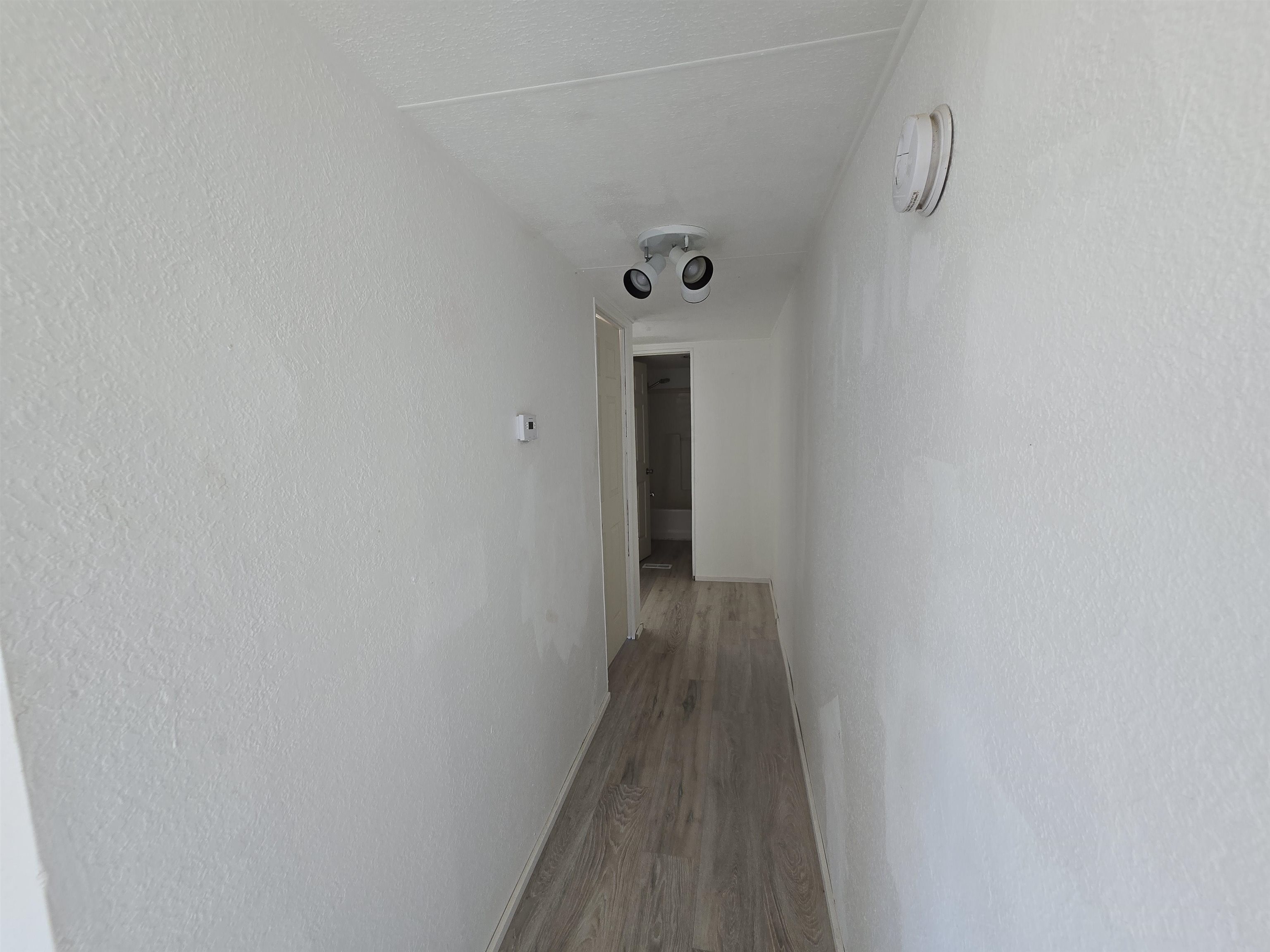 675 1/2 24 1/2 Road Grand Junction, CO 81505 - Photo 12 of 25 a view of a hallway with wooden floor