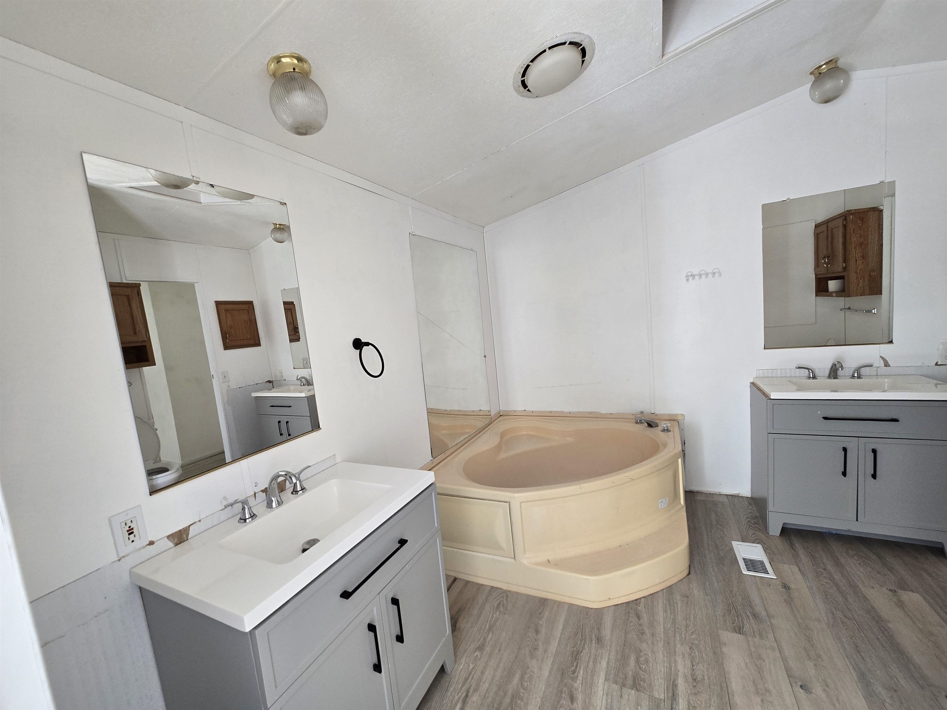 675 1/2 24 1/2 Road Grand Junction, CO 81505 - Photo 16 of 25 a spacious bathroom with a tub sink and mirror