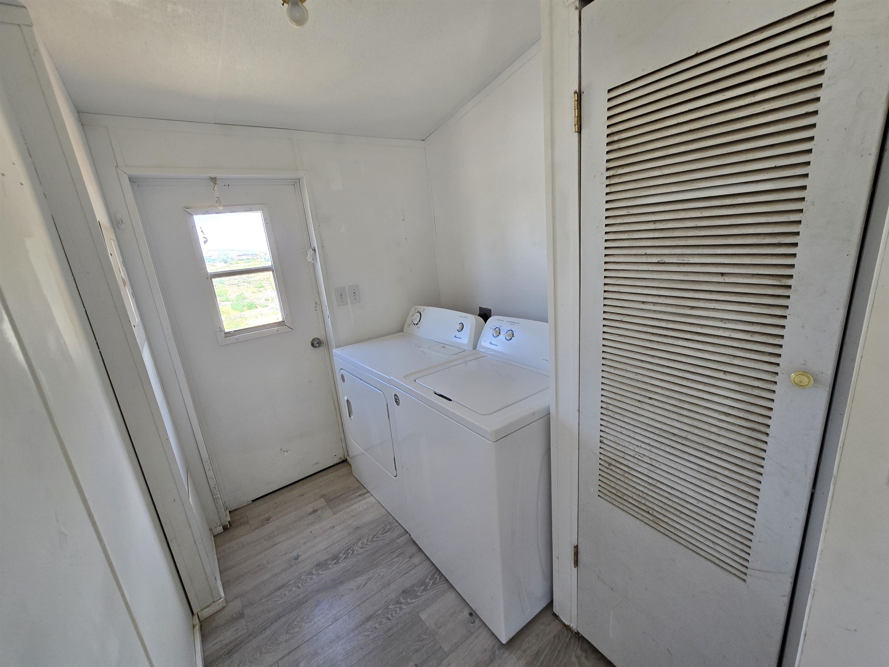 675 1/2 24 1/2 Road Grand Junction, CO 81505 - Photo 20 of 25 a utility room with wooden floor washer and dryer