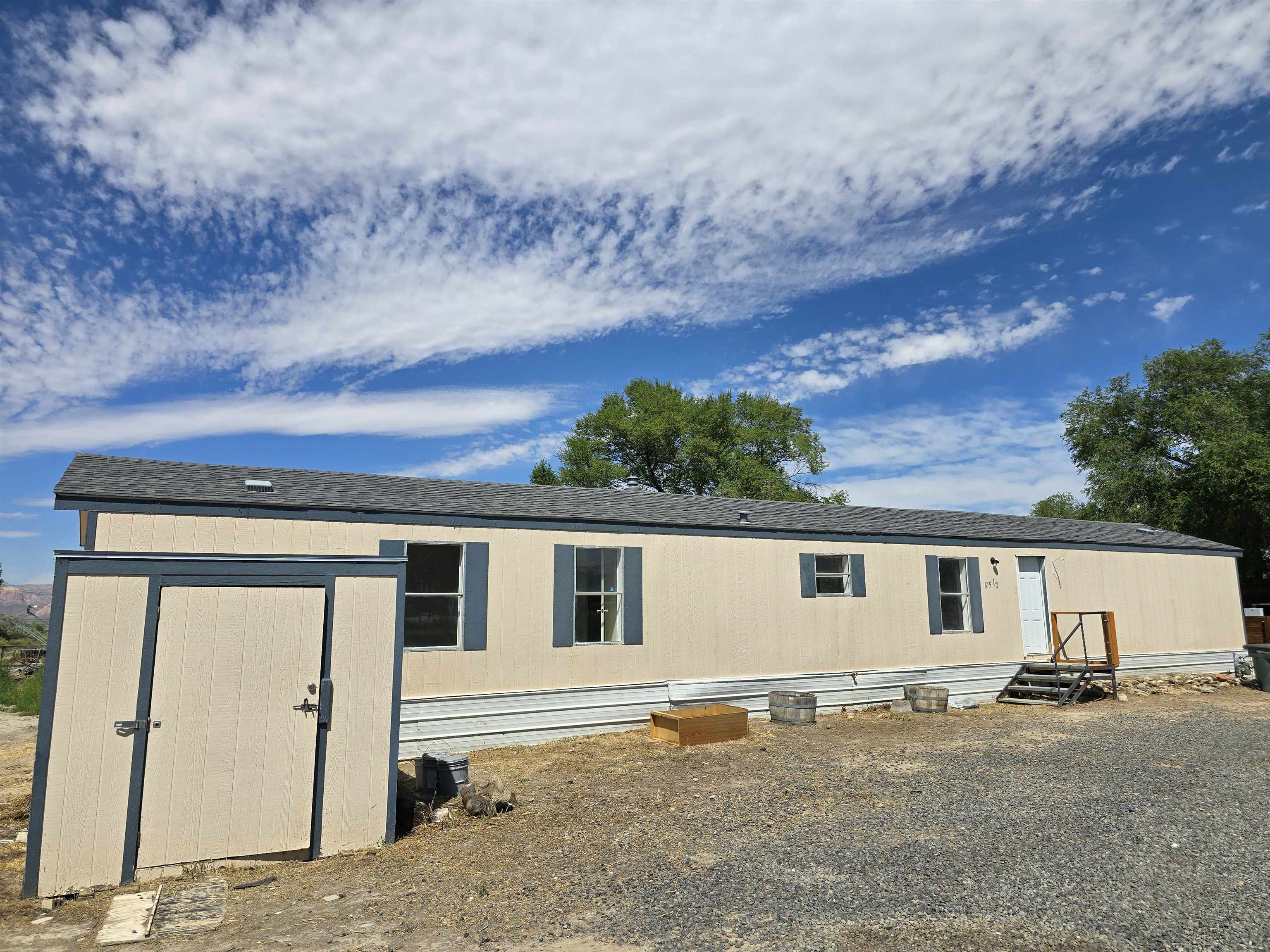 675 1/2 24 1/2 Road Grand Junction, CO 81505 - Photo 25 of 25 front view of a house with a large tree
