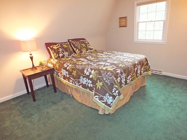 7 Conestoga Road Chelmsford, MA 01824 - Photo 17 of 29 a bed sitting in a bedroom next to a window