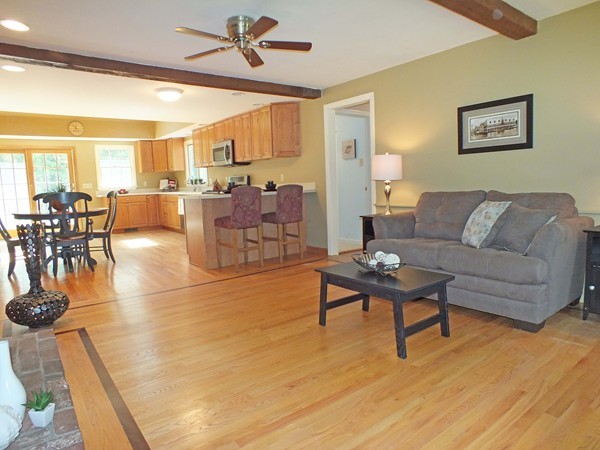 7 Conestoga Road Chelmsford, MA 01824 - Photo 2 of 29 a living room with furniture and a large window