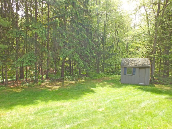 7 Conestoga Road Chelmsford, MA 01824 - Photo 29 of 29 a view of a backyard with pathway