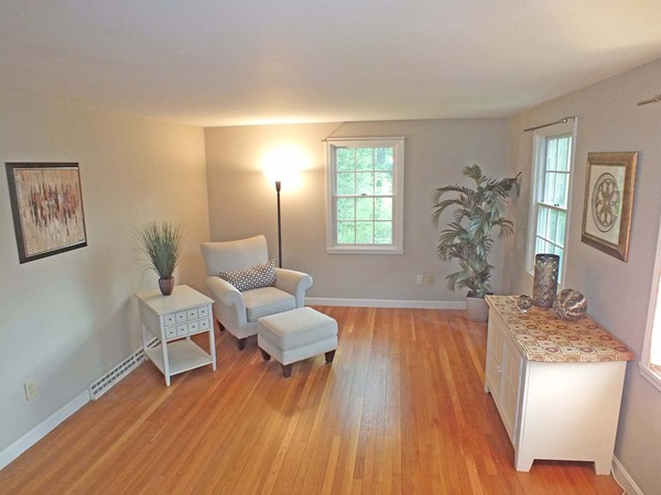 7 Conestoga Road Chelmsford, MA 01824 - Photo 8 of 29 a living room with furniture and a wooden floor