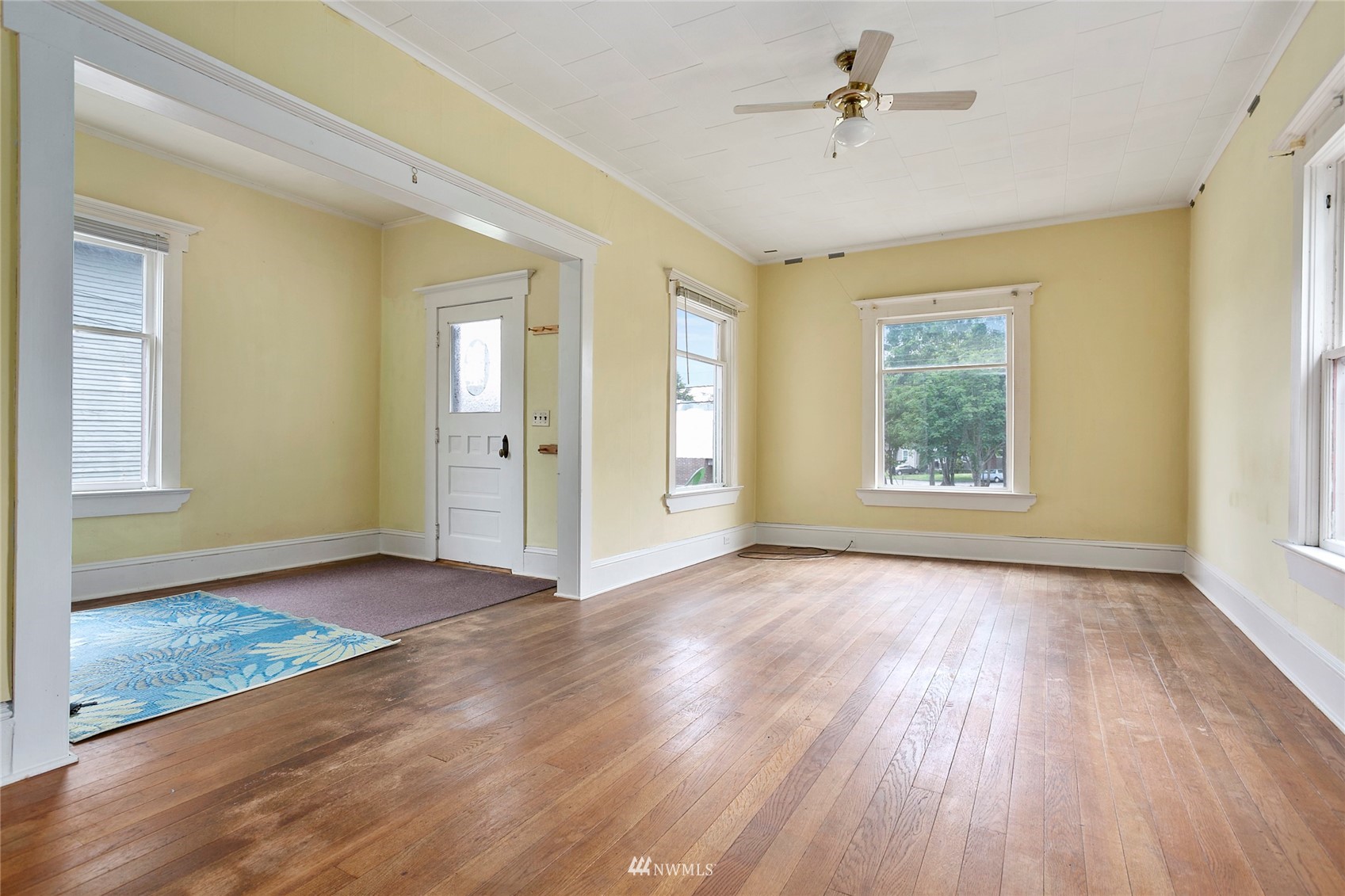 1014 East Maple Street Bellingham, WA 98225 - Photo 11 of 22 a view of an empty room with window and wooden floor