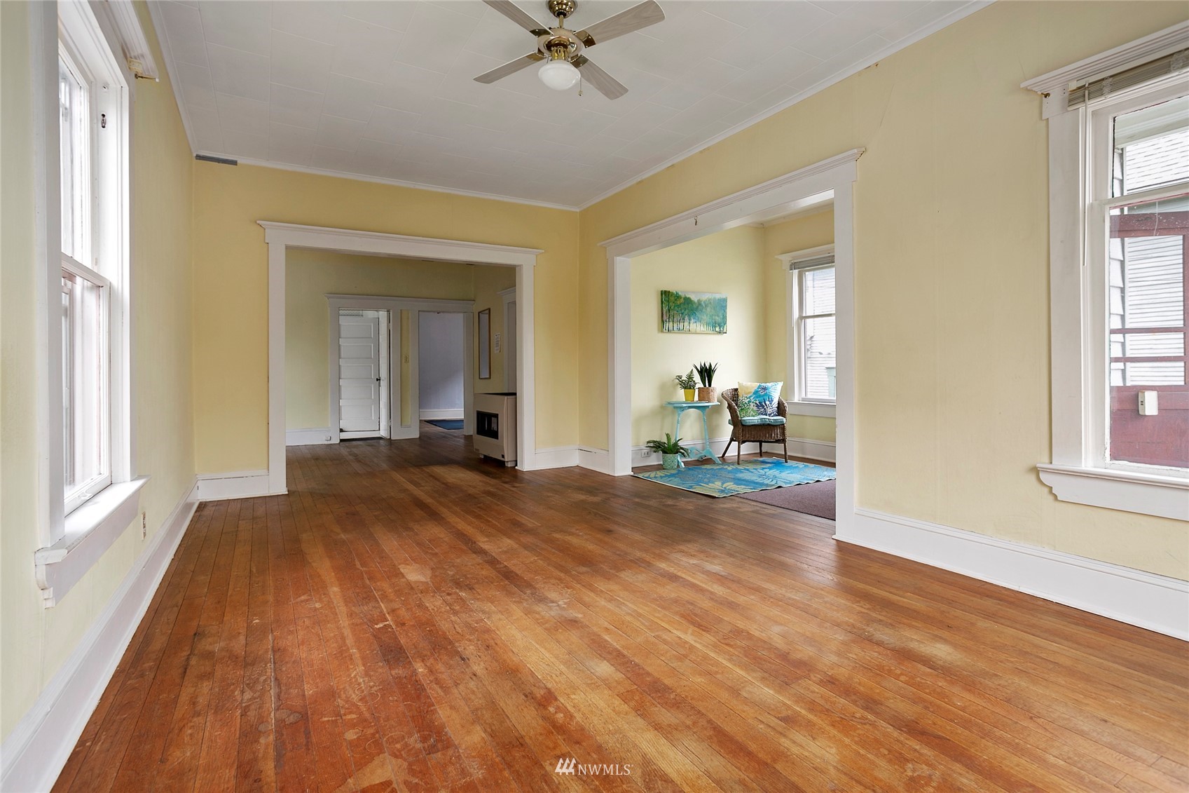 1014 East Maple Street Bellingham, WA 98225 - Photo 5 of 22 a view of a bedroom with wooden floor and a window