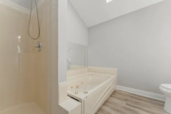 a bathroom with a bathtub and shower
