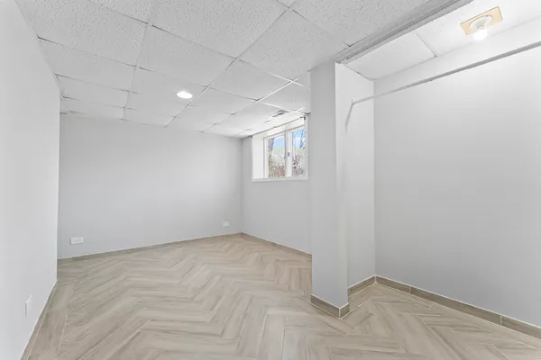 a view of an empty room with a window