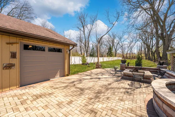 a backyard of a house with outdoor seating