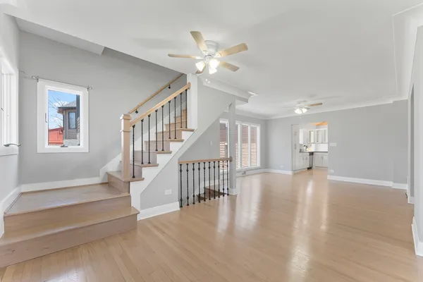 a view of an entryway with wooden floor