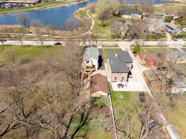 an aerial view of a house with outdoor space