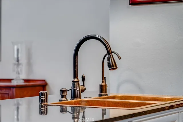 a stove top oven sitting inside of a kitchen
