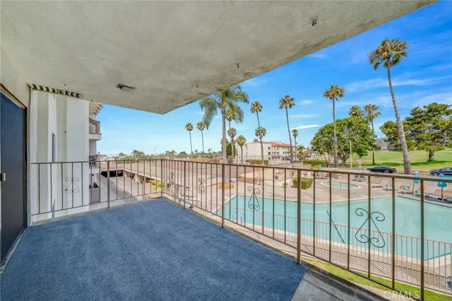 a living room with furniture a flat screen tv and a table