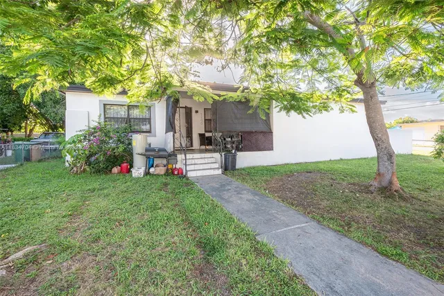 a house that has sitting area in front of it