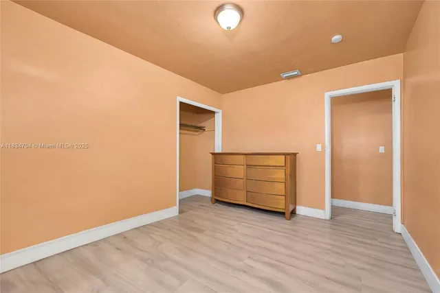 a bathroom with a sink toilet and a mirror