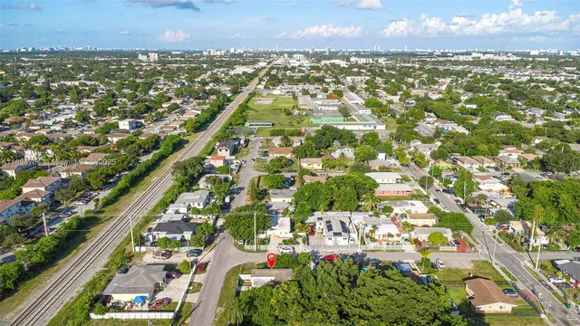an aerial view of residential building and lake