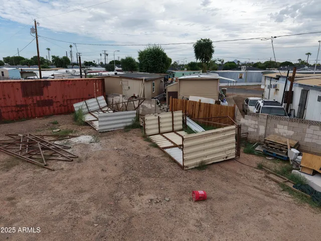 a view of a lake with a car parked on the road