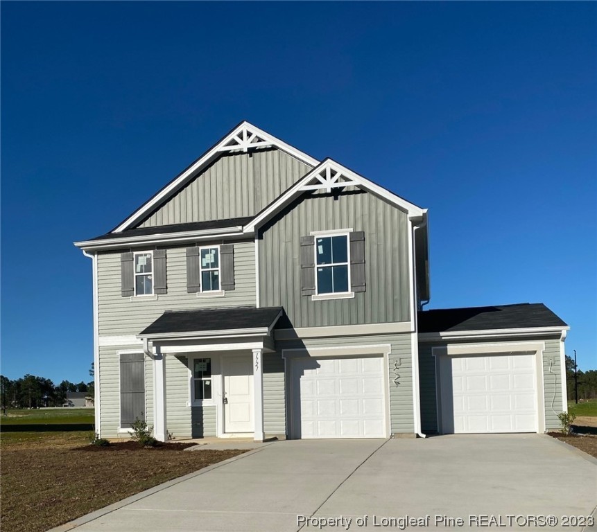 a front view of a house with a garage