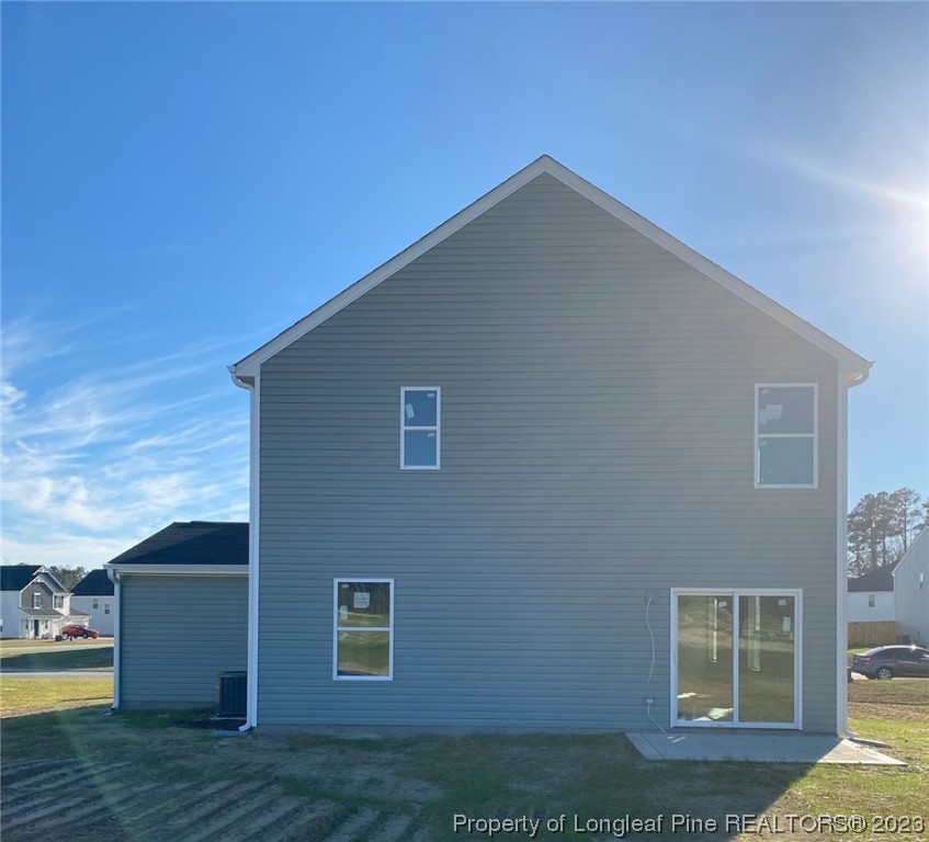 1721 Ennismore Road Hope Mills, NC 28348 - Photo 2 of 9 a backyard of a house with wooden floor