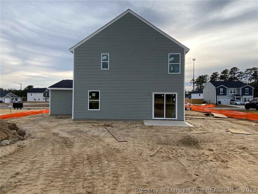 1721 Ennismore Road Hope Mills, NC 28348 - Photo 4 of 9 a backyard of a house with table and chairs