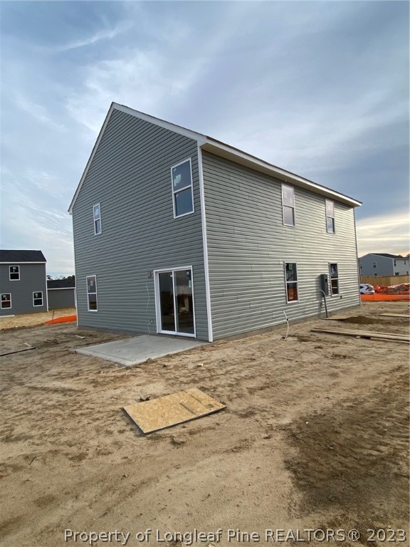 1721 Ennismore Road Hope Mills, NC 28348 - Photo 6 of 9 a view of a house with a backyard