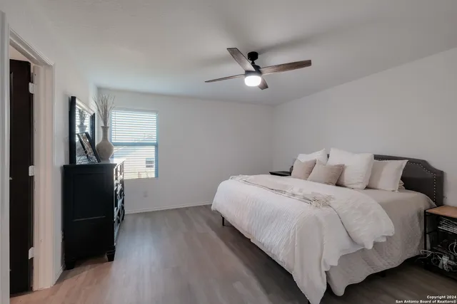 a bedroom with a bed and a window