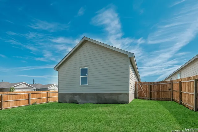 a view of backyard with green space