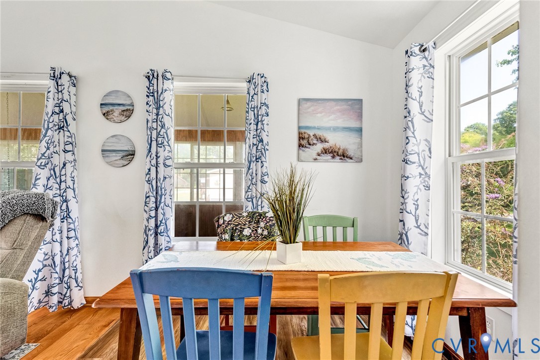 233 Washington Street Reedville, VA 22539 - Photo 8 of 35 Bright dining area showcasing wood-finish flooring