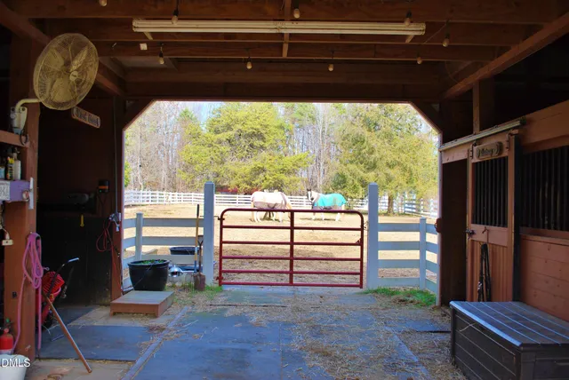 a view of a house with a yard and garden