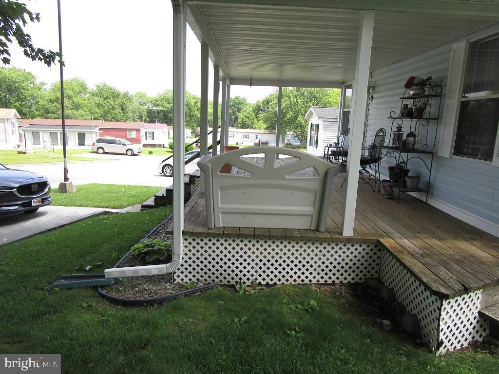 90 Knight Road, Unit 9 Gettysburg, PA 17325 - Photo 2 of 22 a view of a patio with a table chairs and a floor to ceiling window