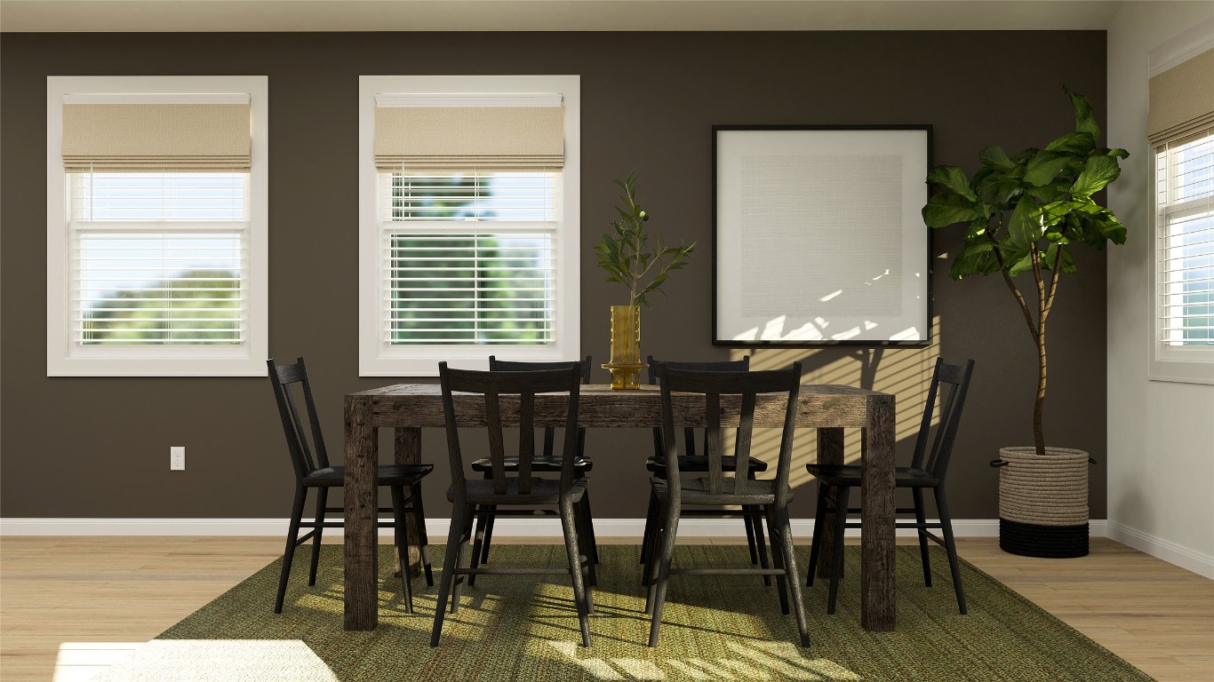 18024 Prairie Falcon Way Pflugerville, TX 78660 - Photo 14 of 23 a view of a dining room with furniture and wooden floor