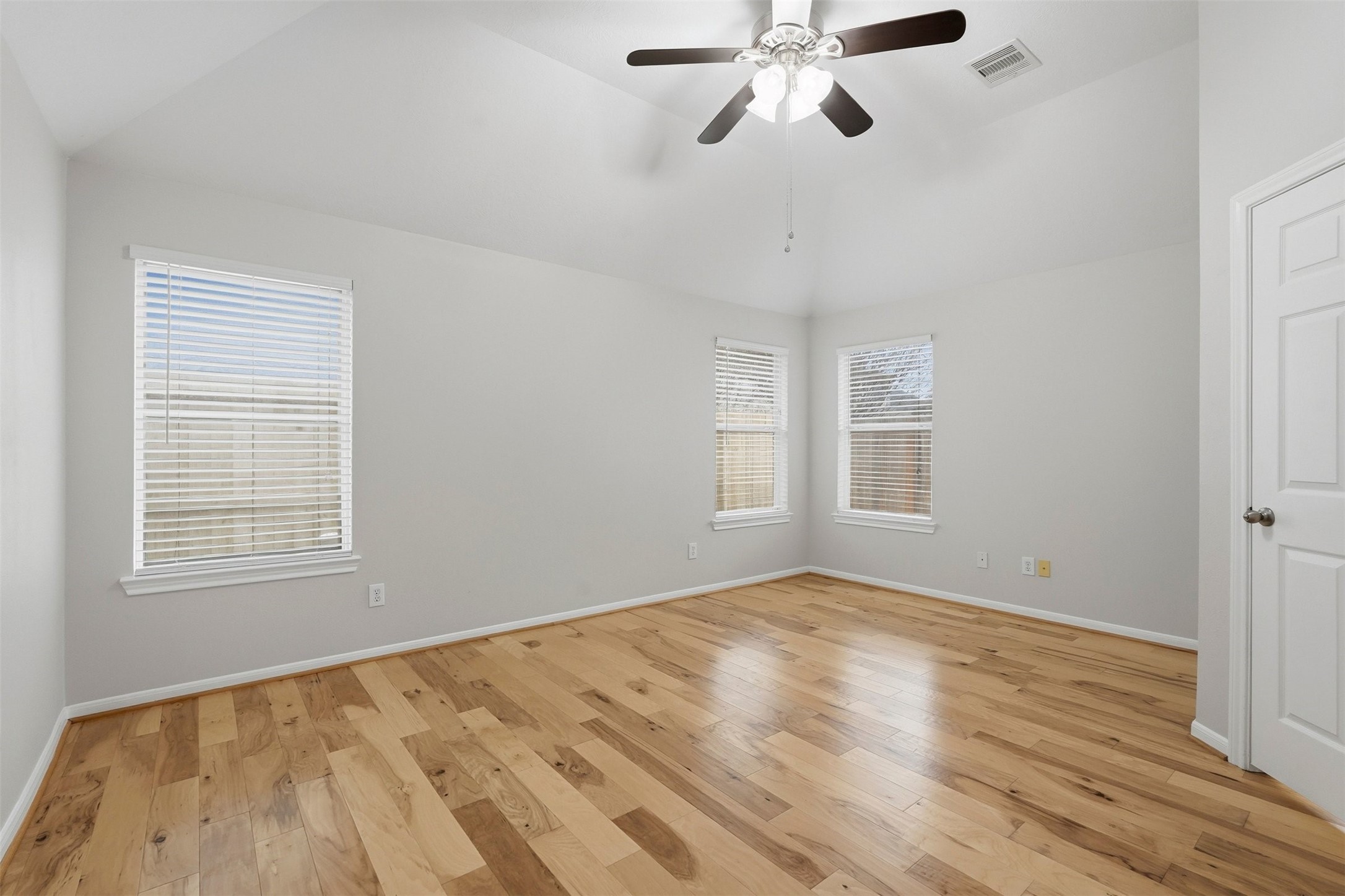 13218 South Point Lane Houston, TX 77034 - Photo 20 of 25 a view of an empty room with a window and wooden floor
