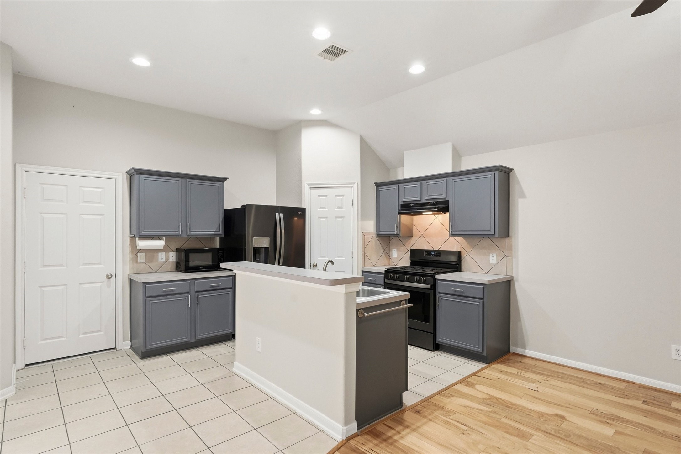 13218 South Point Lane Houston, TX 77034 - Photo 4 of 25 a kitchen with stainless steel appliances granite countertop a stove top oven and sink