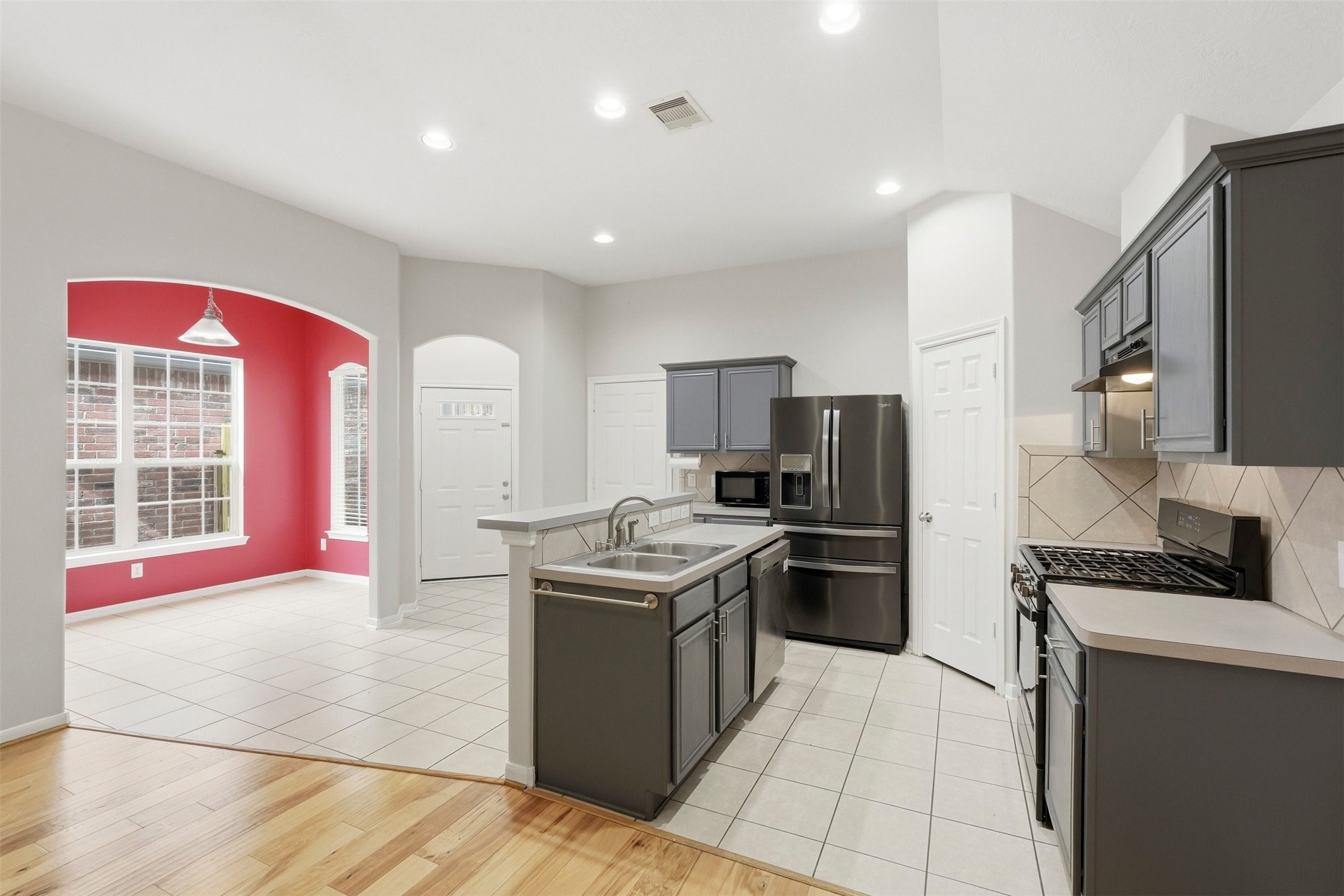 13218 South Point Lane Houston, TX 77034 - Photo 5 of 25 a kitchen with stainless steel appliances granite countertop a stove top oven a sink dishwasher and a refrigerator
