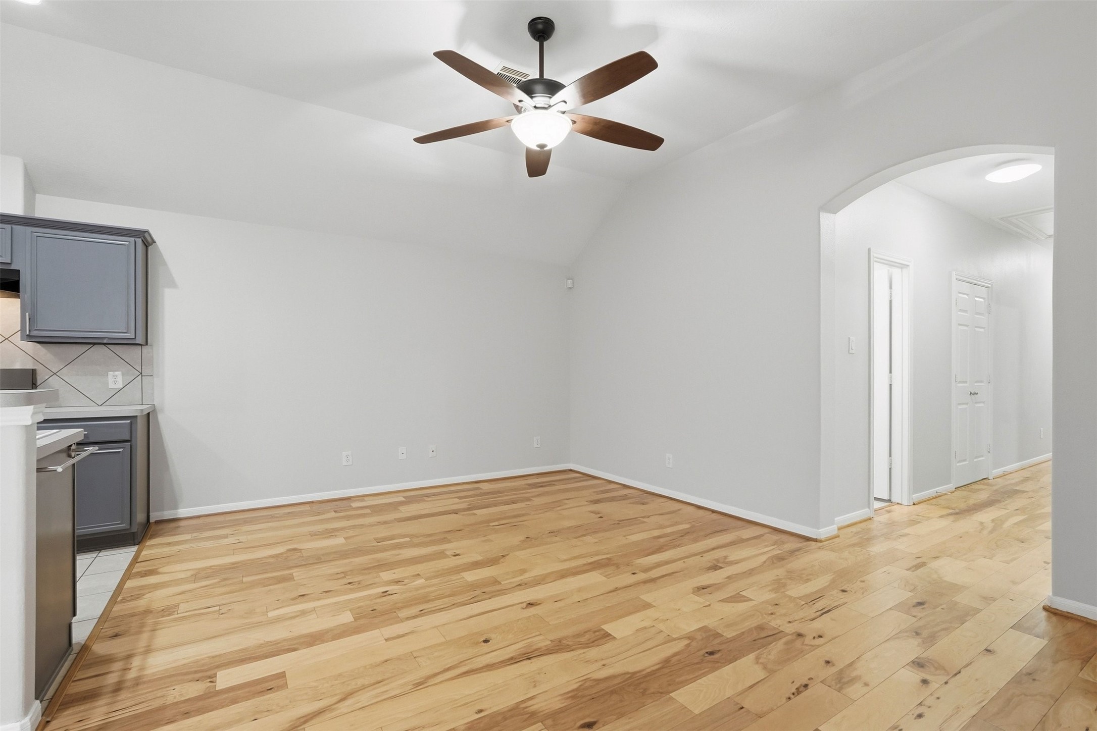 13218 South Point Lane Houston, TX 77034 - Photo 7 of 25 a view of empty room with wooden floor and cabinet
