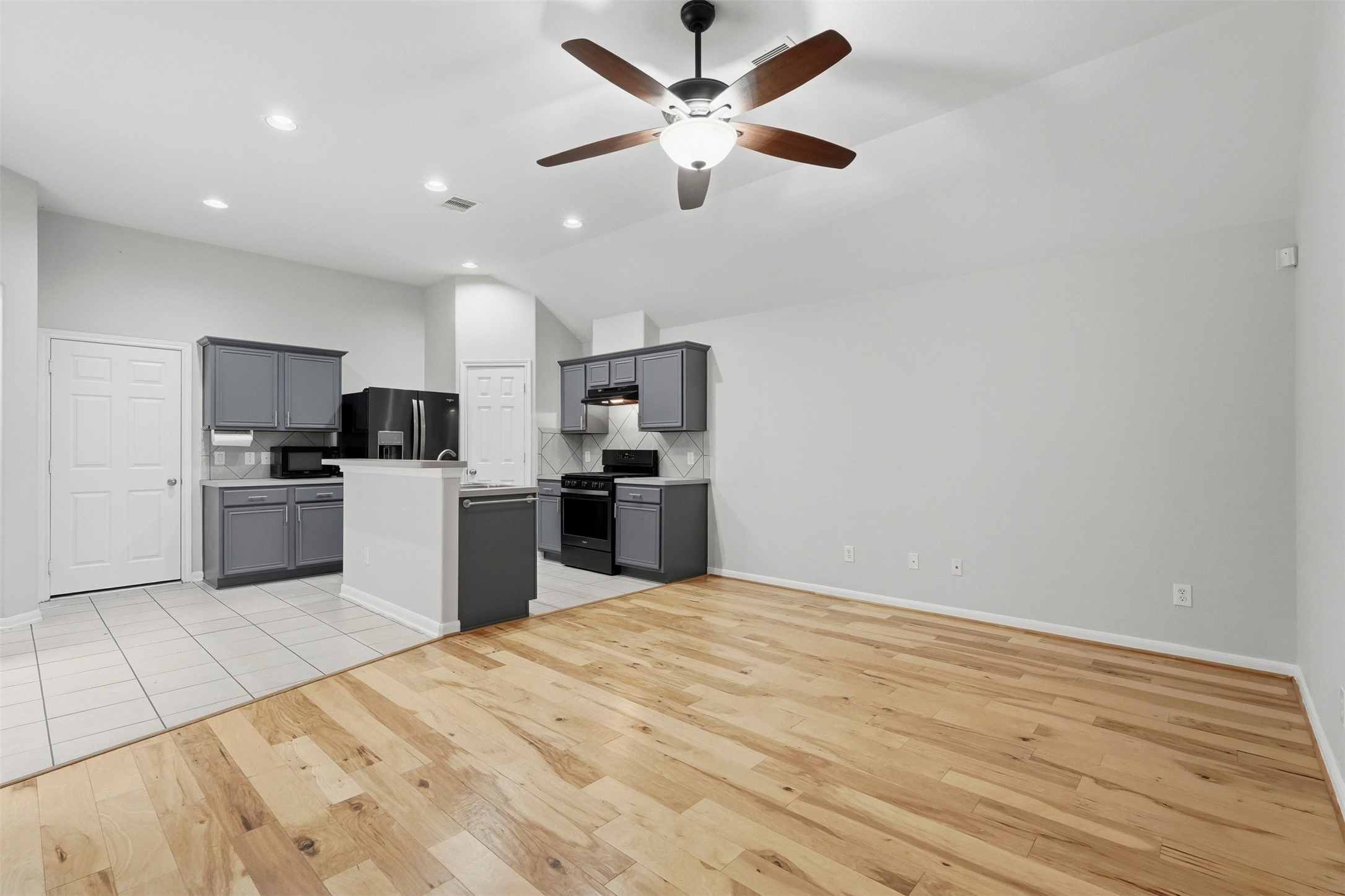 13218 South Point Lane Houston, TX 77034 - Photo 8 of 25 a kitchen with stainless steel appliances kitchen island a refrigerator sink and cabinets