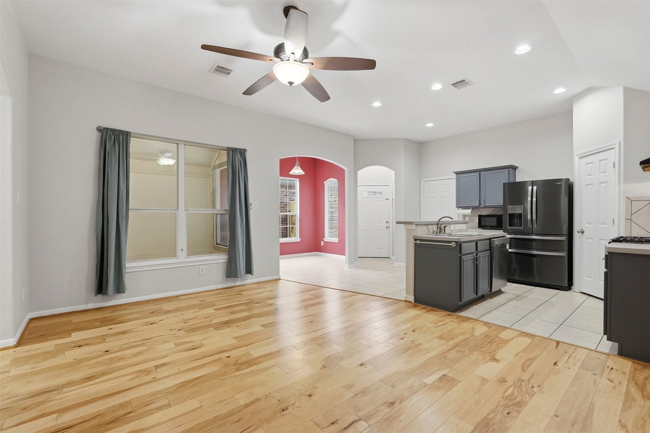 13218 South Point Lane Houston, TX 77034 - Photo 9 of 25 a kitchen with stainless steel appliances kitchen island granite countertop a stove top oven a refrigerator with island and chairs