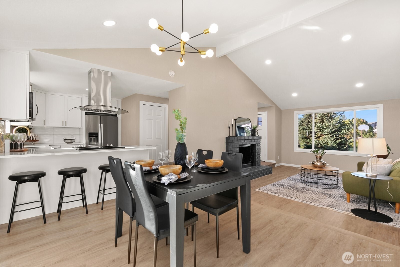 415 Meade Avenue Sumner, WA 98390 - Photo 11 of 23 a view of a dining room with furniture window and wooden floor