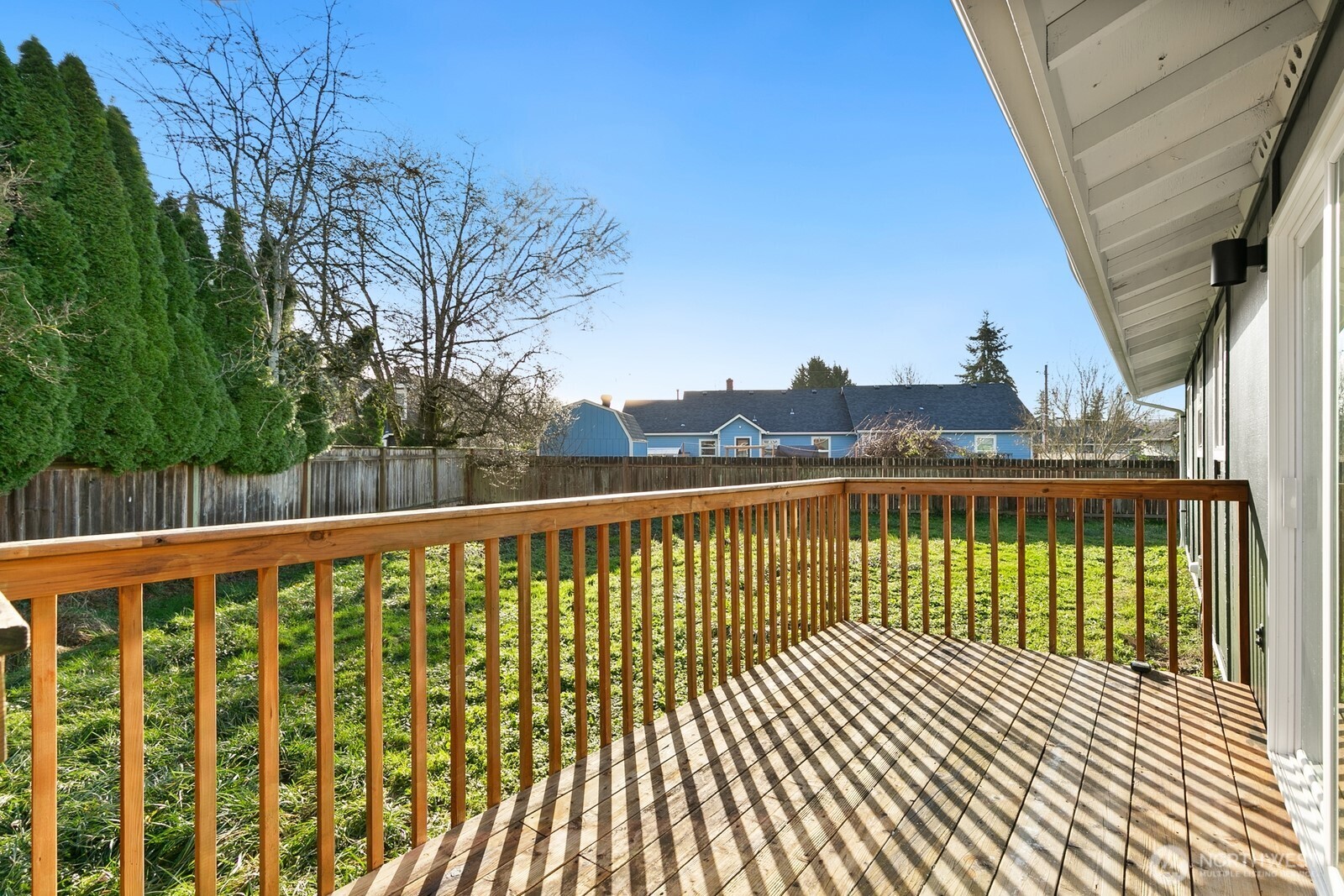 415 Meade Avenue Sumner, WA 98390 - Photo 18 of 23 a view of a balcony with wooden fence