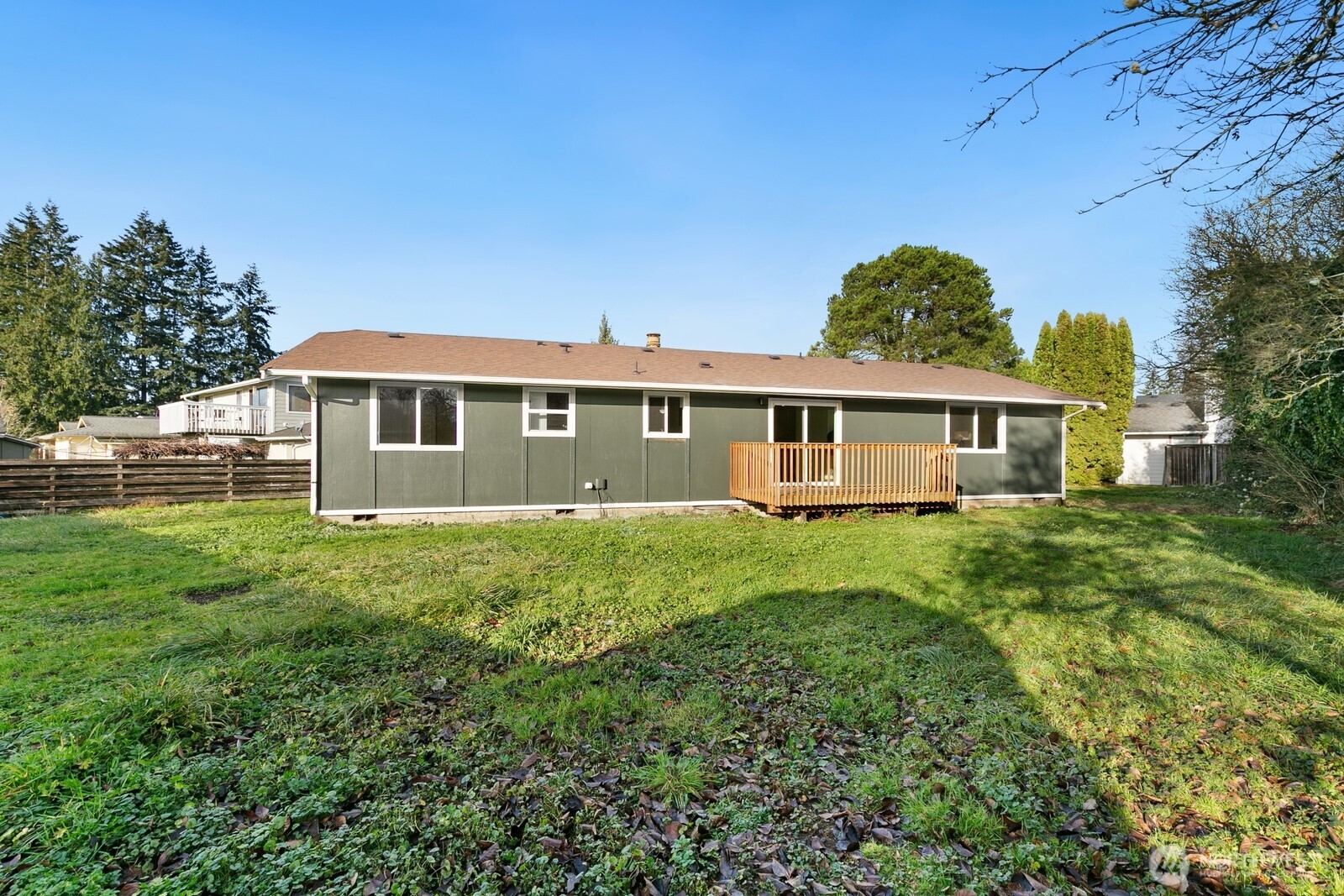 415 Meade Avenue Sumner, WA 98390 - Photo 19 of 23 a view of a house with a backyard