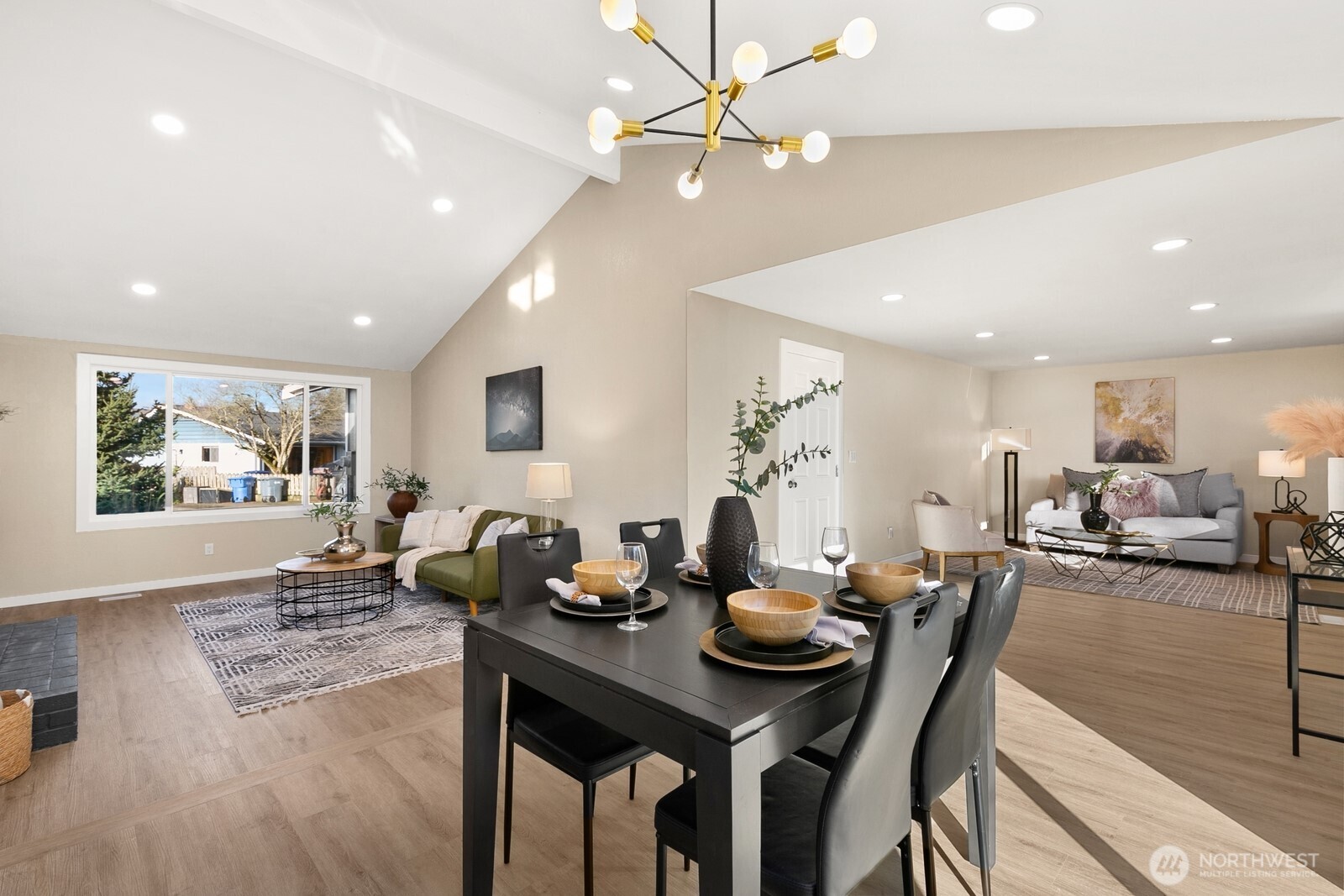 415 Meade Avenue Sumner, WA 98390 - Photo 8 of 23 a view of a dining room with furniture and wooden floor