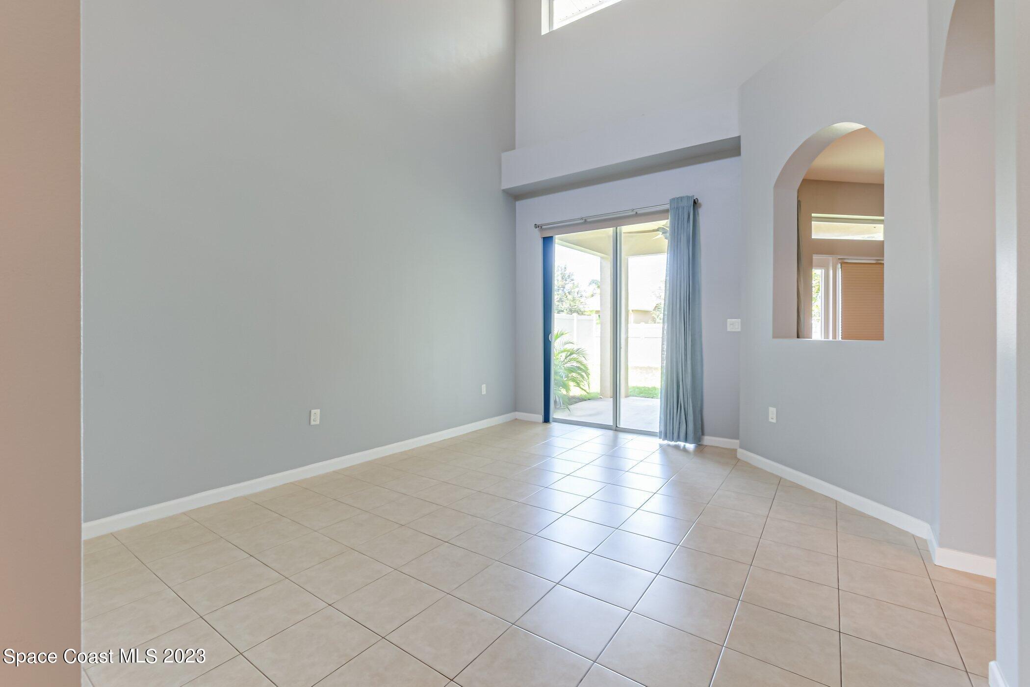 3194 Arden Circle Melbourne, FL 32934 - Photo 15 of 40 an empty room with windows and closet