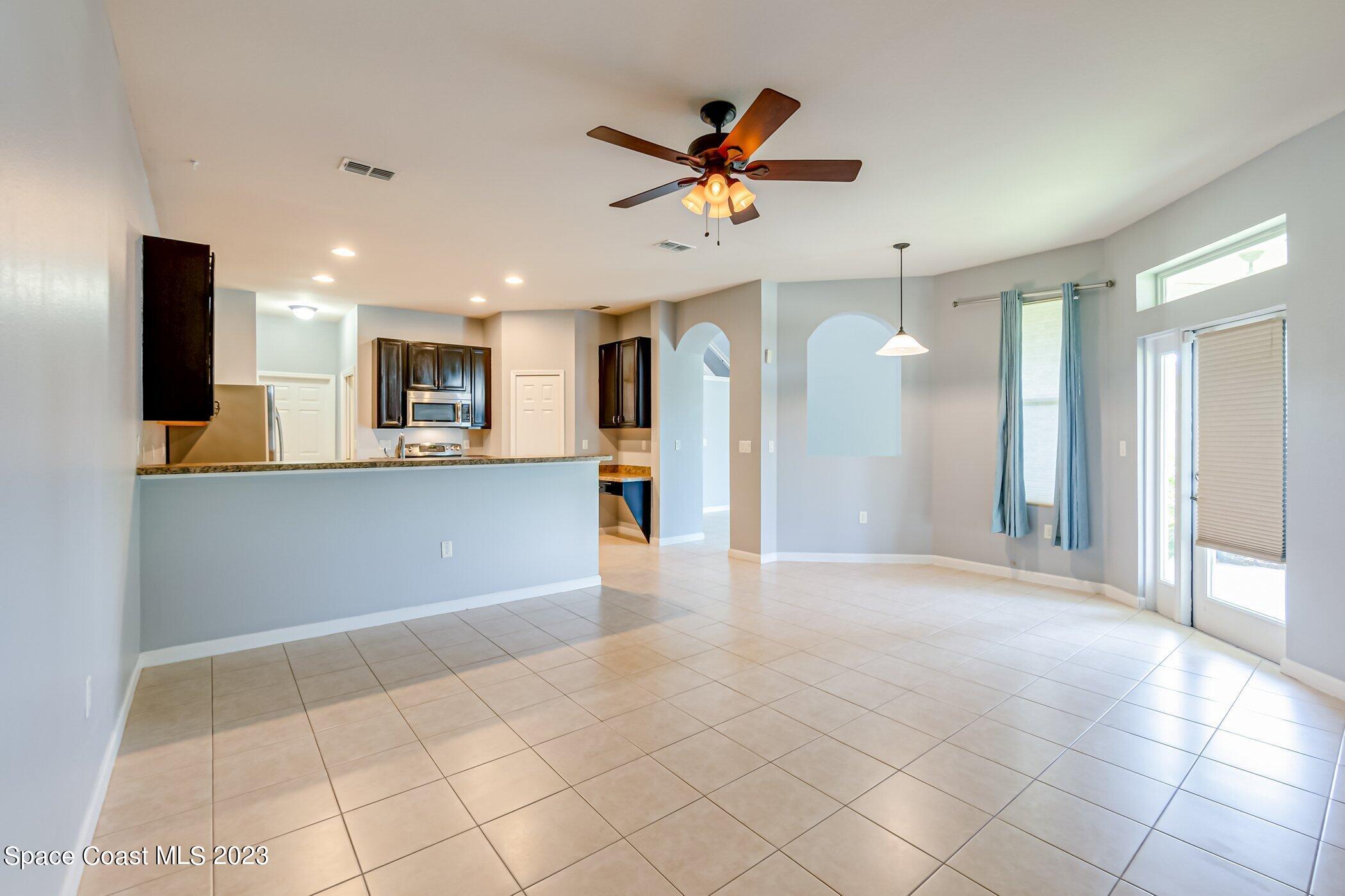 3194 Arden Circle Melbourne, FL 32934 - Photo 19 of 40 a view of a kitchen with a sink and a refrigerator
