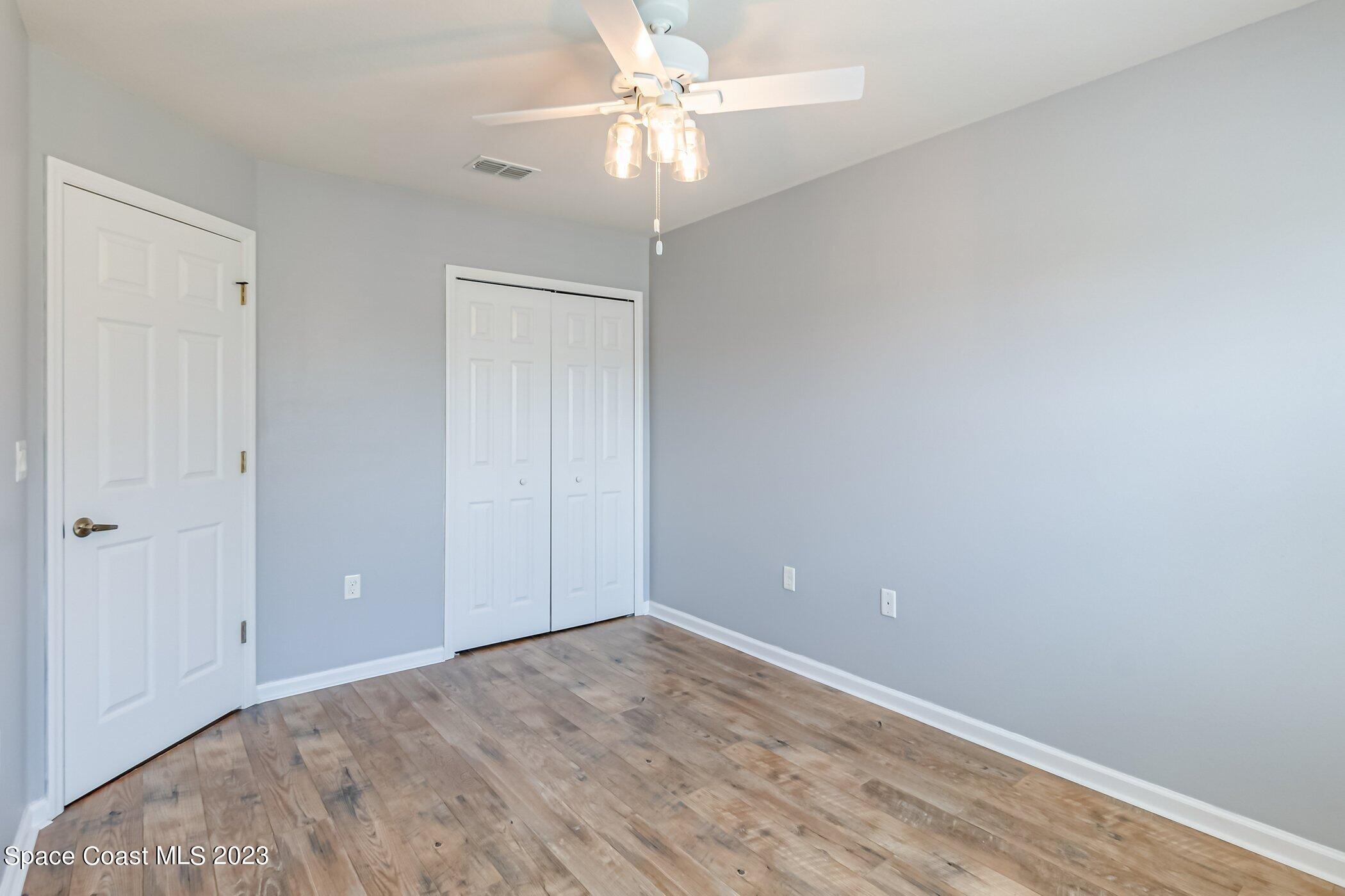 3194 Arden Circle Melbourne, FL 32934 - Photo 32 of 40 wooden floor in an empty room