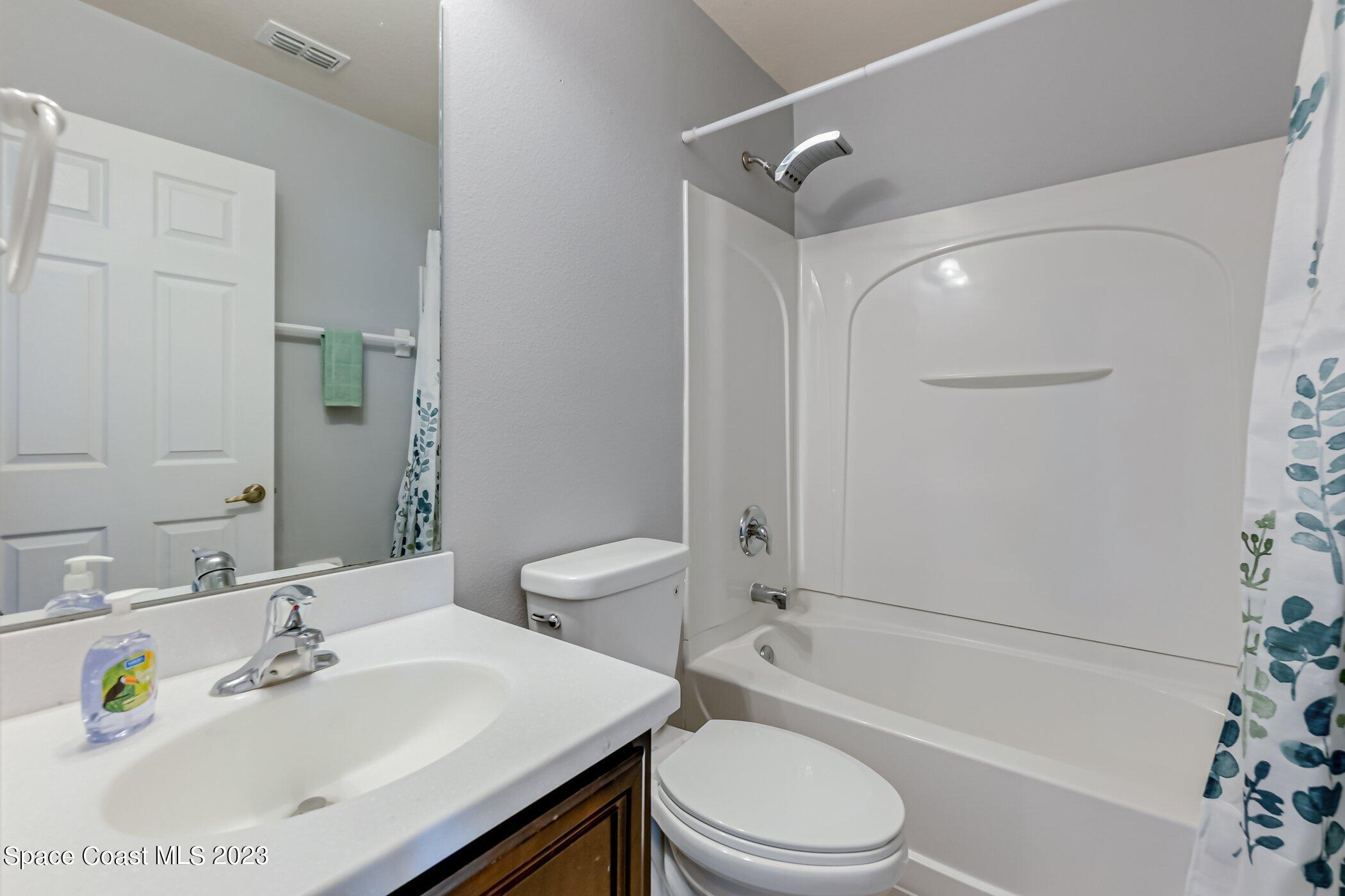 3194 Arden Circle Melbourne, FL 32934 - Photo 33 of 40 a bathroom with a sink toilet and shower