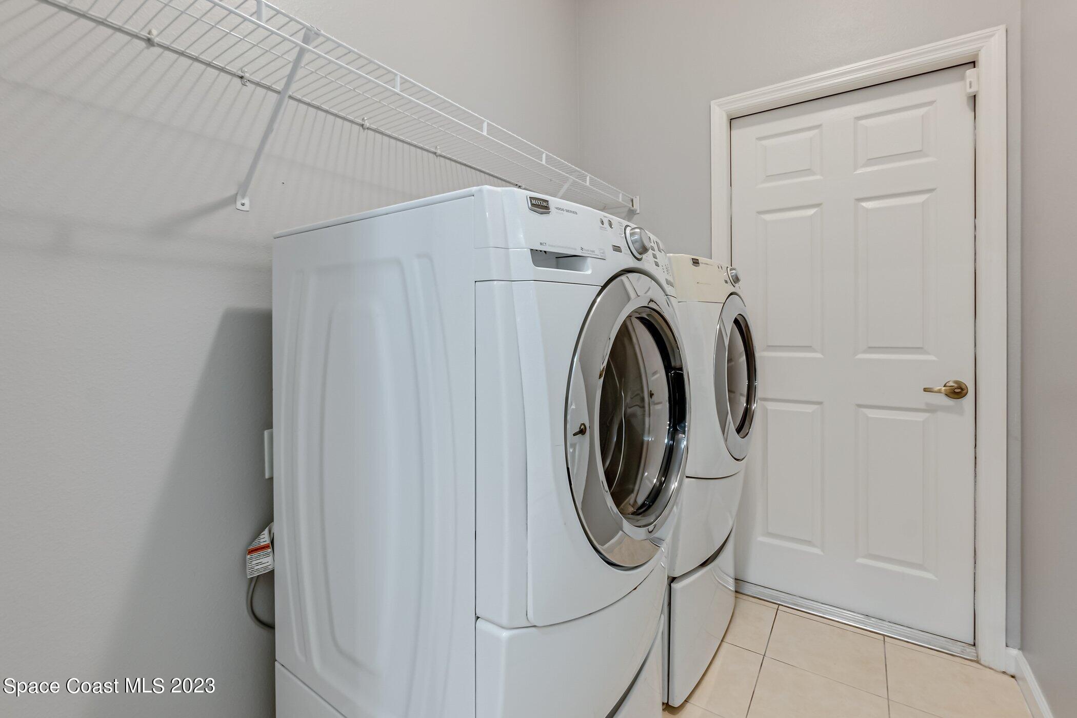 3194 Arden Circle Melbourne, FL 32934 - Photo 37 of 40 a utility room with dryer and washer